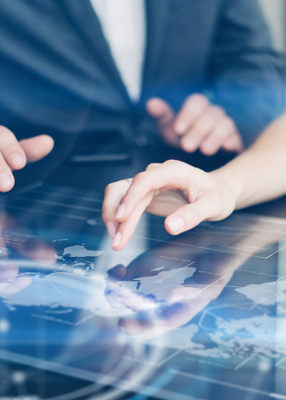 Working on progect using hi technology digital tabletの写真素材