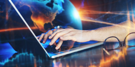 Close-up photo of male hands with laptop. Man is working remotely from home. Freelancer at work