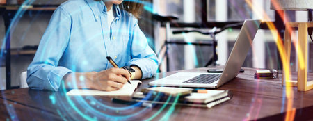 Young beautiful woman working with a laptop. Female freelancer connecting to internet via computer....