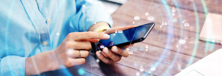 Close-up photo of female hands with smartphone. Concept of networking or remote work. Global business network. Social connectionsの写真素材