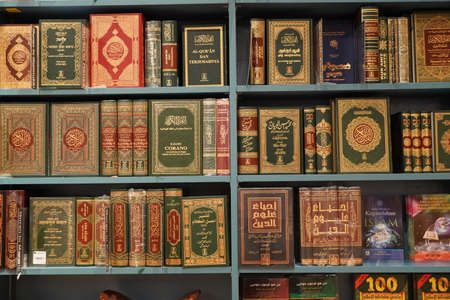 Stack of Quran on the shelf. Quran religious book stacked in shelf for sale. Available in Various languages in a book store. Islamic books for sale, Arabic Religion. Dubai UAE 7 December 2019のeditorial素材
