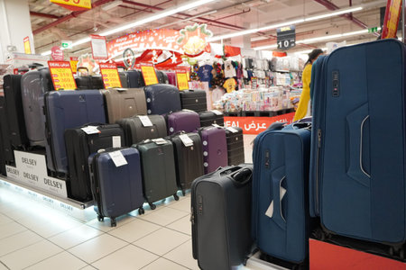 Department store interior view with luggage zone. Multicolored Suitcases in store for sale. Plastic...