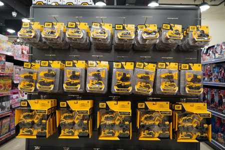 Dubai UAE December 2019 - A collection of CAT excavator and truck toys at Toys store. Toys hanging...