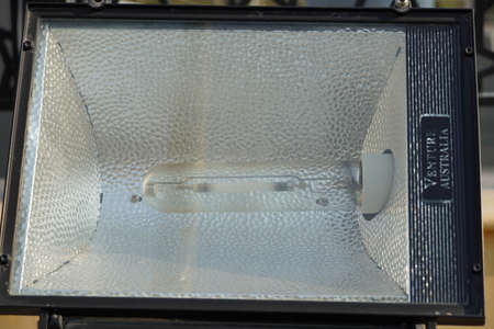 Dubai UAE - November 2019: Close up outdoor LED lamp on the yard. Large outdoor light for building coloring. LED flood light, spot light which lights up a building. Electrical light in the night.のeditorial素材