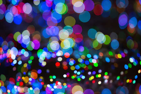 Defocused abstract multicolor bokeh lights background. Blue, purple, green, red, colors-christmas and new year conceptの写真素材
