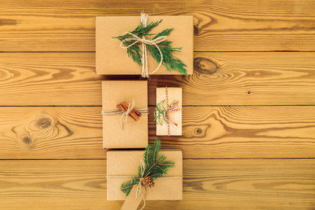 Gift boxes for various holidays, Christmas, Valentines Day, on a wooden background. Zero waste...