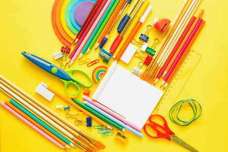 Colorful school and office supplies on yellow background.Copy space.Flat lay. Back to school conceptの写真素材