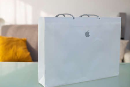 Bologna, Italy: November 11, 2021.Unboxing the new Apple MacBook Pro 14 M1 Pro 2021 laptop out of the box. New laptop in apple packaging on the table at home. Online shopping concept.のeditorial素材