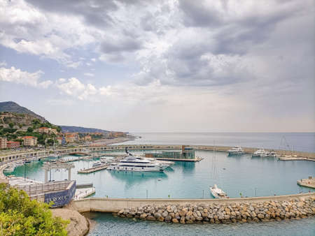 Cala Del Forte, new marina in Ventimiglia, Liguria, Italy owned by Monaco Ports. Beautiful panoramic aerial view from flying drone on Monaco Principality Third Port landmarks, august 12,2021のeditorial素材