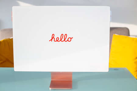 Bologna, Italy: February 14, 2022. Unboxes a brand new modern pink 2021 Apple iMac M1 laptop from the box. New laptop in apple packaging on the table at home. Online shopping concept.のeditorial素材