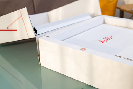 Bologna, Italy: February 14, 2022.Unboxing the new modern Apple pink iMac M1 ,2021 laptop out of the...