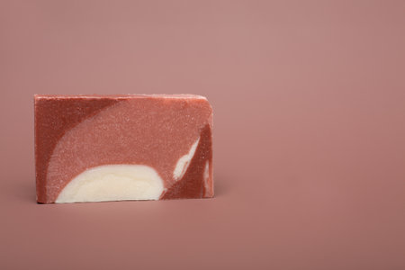 Natural multi-colored solid handmade soap a mocha mousse background. Eco-friendly natural handmade cosmetics. Natural spa products and decor for bathの写真素材