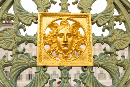 Gates of the Royal Palace 1840 in Turin ,Piedmont, Italy . Wall detail at the Royal Palace of Turin,Italy. Golden mask onの写真素材