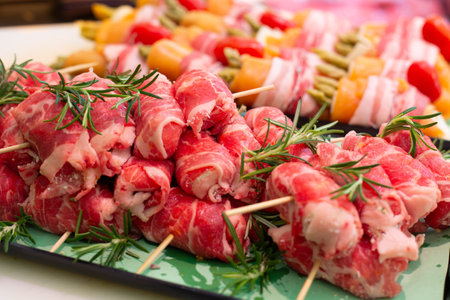 Meat rolls. Raw pork rolls stuffed with ham and cheese seasoned with rosemary. Pork loin. Semi-finished raw productの写真素材
