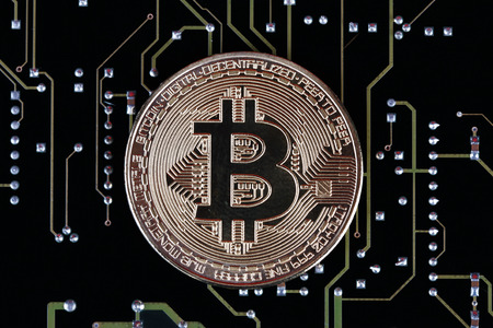 Bitcoin on printed circuit boardの写真素材