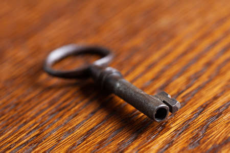 vintage old key on wooden tableの写真素材