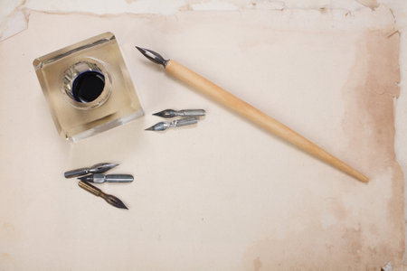 old papers and pen with vintage inkwell backgroundの写真素材