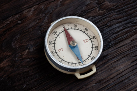 Vintage retro compass on wooden deck backgroundの写真素材