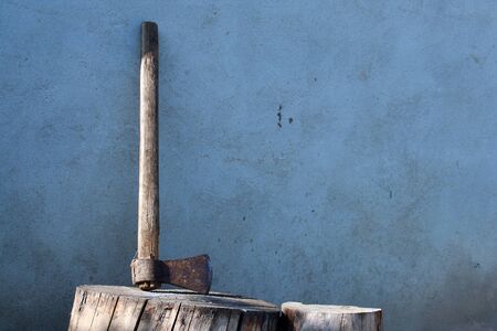 Old ax  on a piece of wood.の写真素材