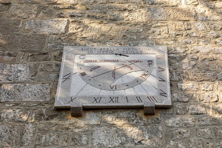 Sundial, ancient method, instrument for measuring the passage of time on the stone wall of an ancient building in a sanctuary.の写真素材