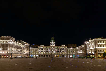 Piazza UnitÃ  d`Italia is the main square in Trieste. Night photography. Artificial light, visible the historic municipal building.のeditorial素材