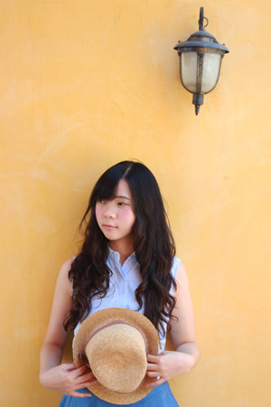 a girl with yellow の写真素材