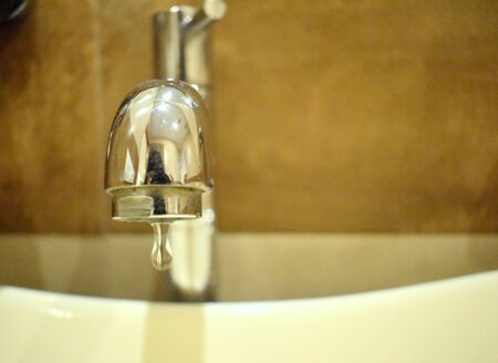 Save water - water leaking from tapの写真素材
