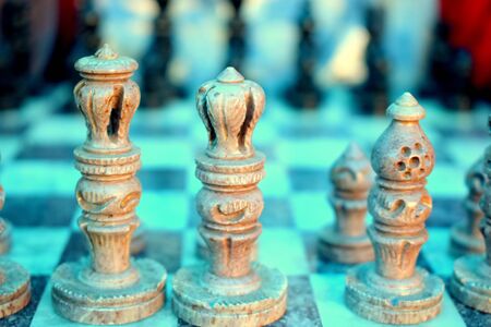 Game of chess - white pieces in focusの写真素材