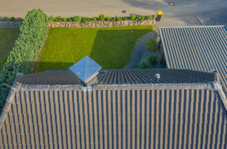Lightning conductor rod on a rooftop of one family house.の写真素材