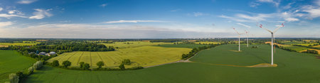 Panorama aerial view of countryside infrastructure windmills, agriculture fields, plant and farm....