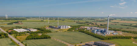 Panoramic aerial view of industrial park and bioenergy plant. Concept of sustainable production of biogas. Concept of biomass heat and power. Renewable and low carbon energies prodの写真素材