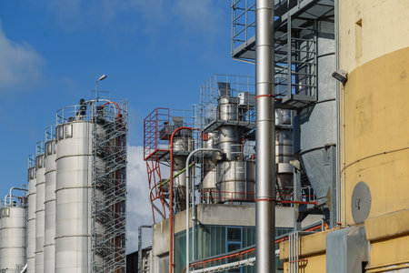 Industrial view at oil refinery plant and silos from industry zone. Refinery factory oil storage tank.View of industrial plant of natural fiber industry. Industrial landscape withの写真素材