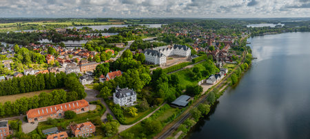 Panoramic aerial view of Ratzeburg with cathedral on green island, old town, marina and tour boat on Lake Ratzeburg, Schleswig-Holstein, Germany.の写真素材