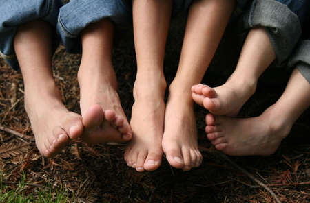 Childrens' feet posed togetherの写真素材