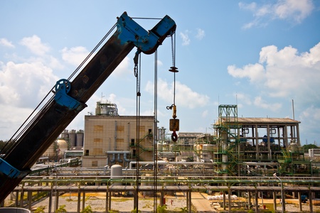 crane standing on a construction site under construction petrochemical plantsのeditorial素材