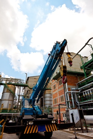 crane standing on a construction site under construction petrochemical plantsのeditorial素材