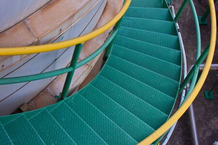 Stairs on tank in factoryの写真素材