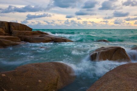 stone and waves during sundown  Natural compositionの写真素材