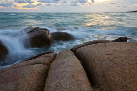 stone and waves during sundown  Natural composition