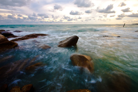 stone and waves during sundown  Natural composition