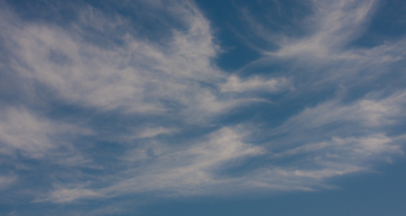 fantastic soft white clouds against blue skyの写真素材