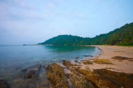 a stone beach in mountain backgroundの写真素材