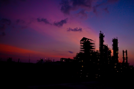 petrochemical plant in silhouette image at sun setの写真素材
