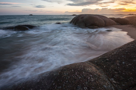 view of a rocky coast in sunset