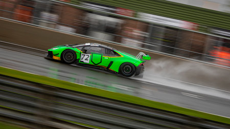 A shot of a racing car as it circuits a track.の写真素材