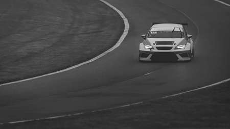 A shot of a racing car as it circuits a track.の写真素材