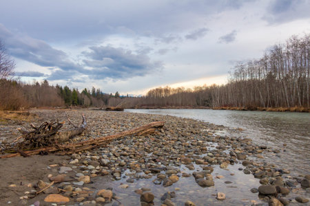 Beautiful spring sunset on a glacial green river in British Columbia, Canada.