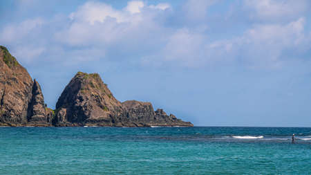 The rocky shoreline at Mawun Bay and beach, near Kuta Lombok, Indonesiaの写真素材