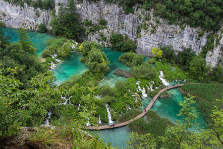A view over a series of lakes and waterfalls at Plitvice Lakes, Croatiaの写真素材