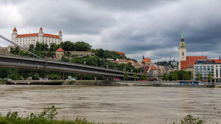 Bratislava, Slovakia - July 5th 2020: Bratislava Castle over looking the River Danube and the Most SNP Bridge, in the old town, Slovakiaのeditorial素材